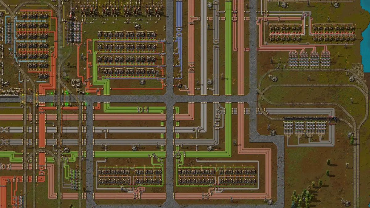 Official Factorio screenshot of parallel transport belts feeding organized production blocks